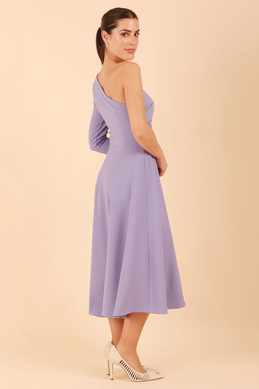 model wearing a diva catwalk Beverley One Shoulder A-line Dress in ribbed super stretch fabric and one long sleeve a-line skirt midi length in vista blue colour side