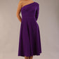 model wearing a diva catwalk Beverley One Shoulder A-line Dress in ribbed super stretch fabric and one long sleeve a-line skirt midi length in passion purple colour front