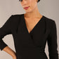 model wearing a diva catwalk pleated shoulder detail of the SEED Addison pencil dress (Black)