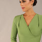 model wearing a diva catwalk pleated shoulder detail of the SEED Addison pencil dress (Citrus Green)