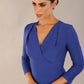 model wearing a diva catwalk pleated shoulder detail of the SEED Addison pencil dress (Monaco Blue)