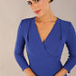 model wearing a diva catwalk pleated shoulder detail of the SEED Addison pencil dress (Monaco Blue)