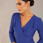 model wearing a diva catwalk pleated shoulder detail of the SEED Addison pencil dress (Monaco Blue)