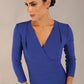 model wearing a diva catwalk pleated shoulder detail of the SEED Addison pencil dress (Monaco Blue)
