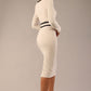  Model wearing the diva catwalk SEED Bethany bow detail pencil dress in sandy cream with black trim (Sandy Cream / Black)