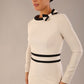  Model wearing the diva catwalk SEED Bethany bow detail pencil dress in sandy cream with black trim (Sandy Cream / Black)
