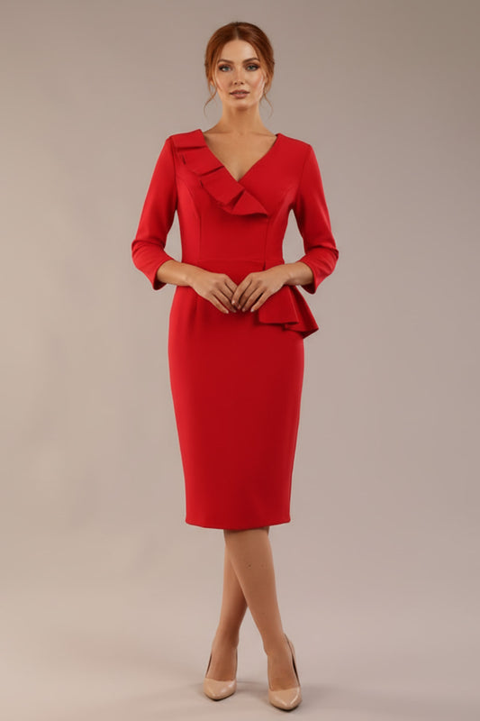 A woman modeling the diva catwalk  SEED Dolores cascade ruffle pencil dress in salsa red with a v-neckline and concealed zip at the back (Salsa Red)