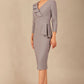 A woman modeling the diva catwalk  SEED Dolores cascade ruffle pencil dress in sky grey with a v-neckline and concealed zip at the back (Sky Grey)