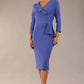 A woman modeling the diva catwalk  SEED Dolores cascade ruffle pencil dress in thistle blue with a v-neckline and concealed zip at the back (Thistle blue)