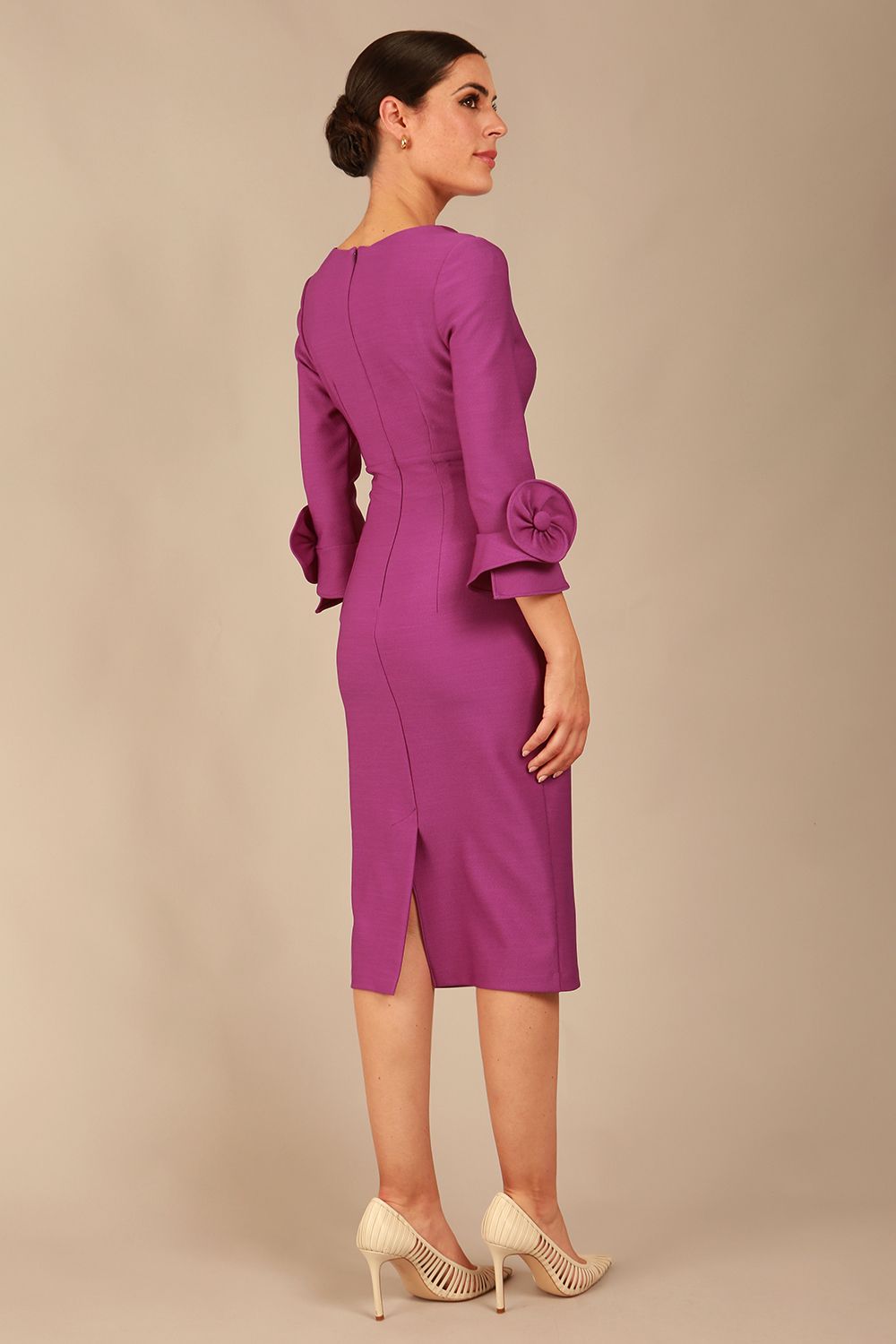 Model wearing the diva catwalk SEED Cicely rosette cuff pencil dress highlighting the asymmetric pleated waist and sculpted fit (Amethyst Purple)