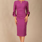 Model wearing the diva catwalk SEED Cicely rosette cuff pencil dress highlighting the asymmetric pleated waist and sculpted fit (Amethyst Purple)