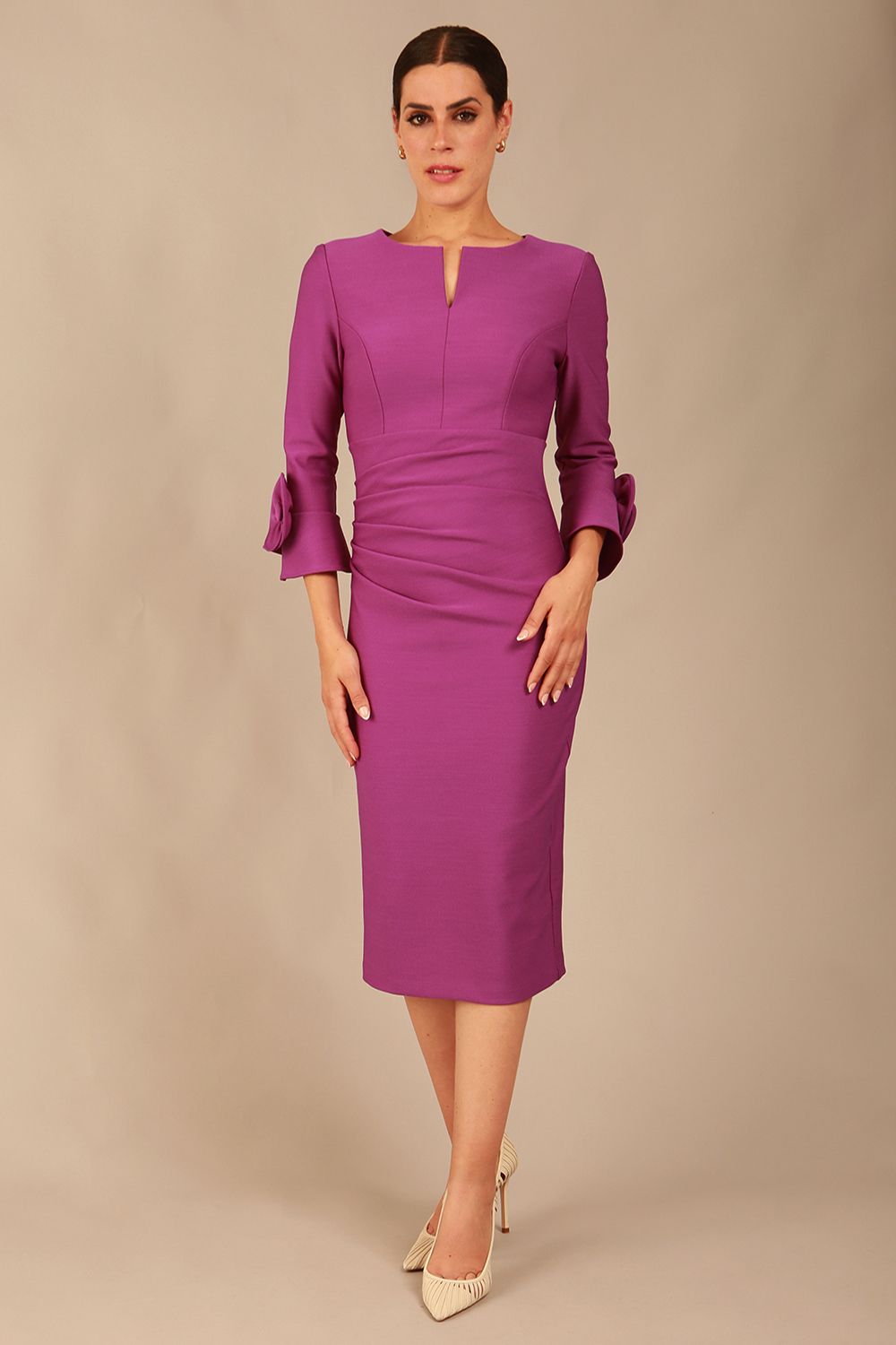 Model wearing the diva catwalk SEED Cicely rosette cuff pencil dress highlighting the asymmetric pleated waist and sculpted fit (Amethyst Purple)