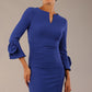 Model wearing the diva catwalk SEED Cicely rosette cuff pencil dress highlighting the asymmetric pleated waist and sculpted fit (Monaco Blue)