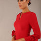 Model wearing the diva catwalk SEED Cicely rosette cuff pencil dress highlighting the asymmetric pleated waist and sculpted fit (Salsa Red)