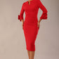Model wearing the diva catwalk SEED Cicely rosette cuff pencil dress highlighting the asymmetric pleated waist and sculpted fit (Salsa Red)