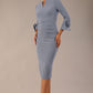 Model wearing the diva catwalk SEED Cicely rosette cuff pencil dress highlighting the asymmetric pleated waist and sculpted fit (Steel Blue)