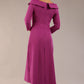 A model wearing a diva catwalk SEED Chrysanta sculptural collar dress 3/4 sleeve A-line dress with a round neckline and concealed zip at the back (Dawn Purple)