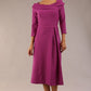 A model wearing a diva catwalk SEED Chrysanta sculptural collar dress 3/4 sleeve A-line dress with a round neckline and concealed zip at the back (Dawn Purple)