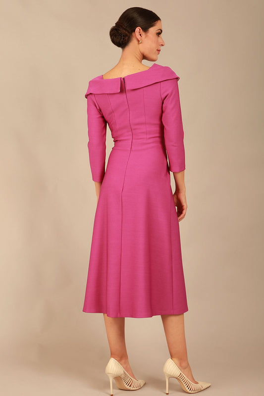 A model wearing a diva catwalk SEED Chrysanta sculptural collar dress in magenta mist 3/4 sleeve A-line dress with a round neckline and concealed zip at the back (Magenta Mist)