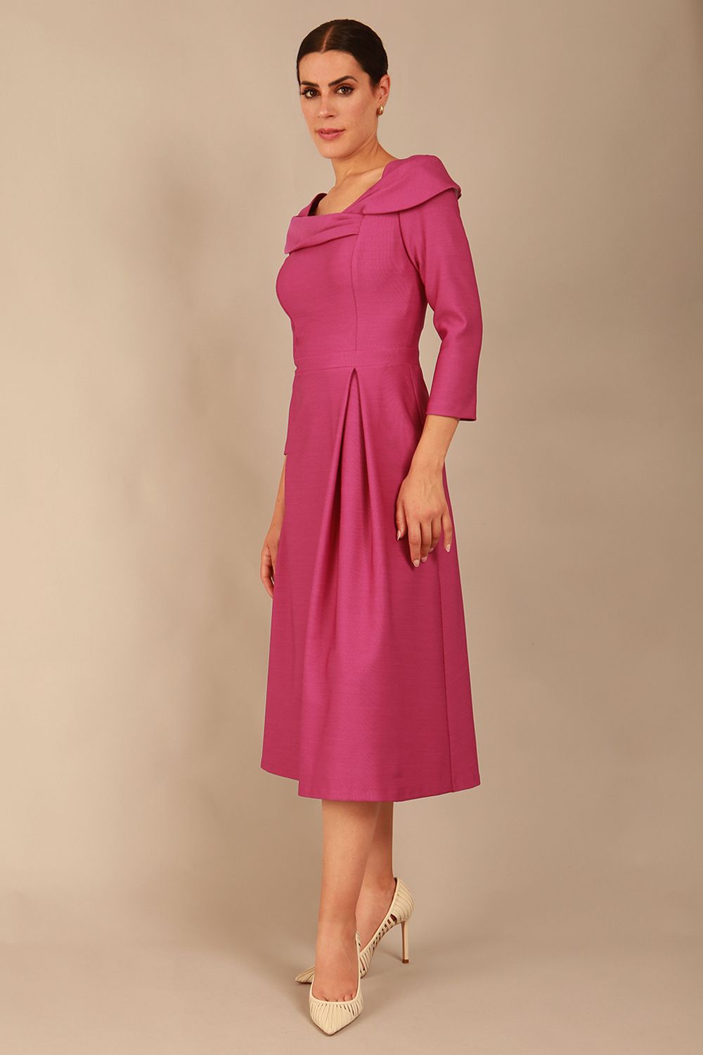 A model wearing a diva catwalk SEED Chrysanta sculptural collar dress in magenta mist 3/4 sleeve A-line dress with a round neckline and concealed zip at the back (Magenta Mist)