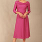 A model wearing a diva catwalk SEED Chrysanta sculptural collar dress in magenta mist 3/4 sleeve A-line dress with a round neckline and concealed zip at the back (Magenta Mist)