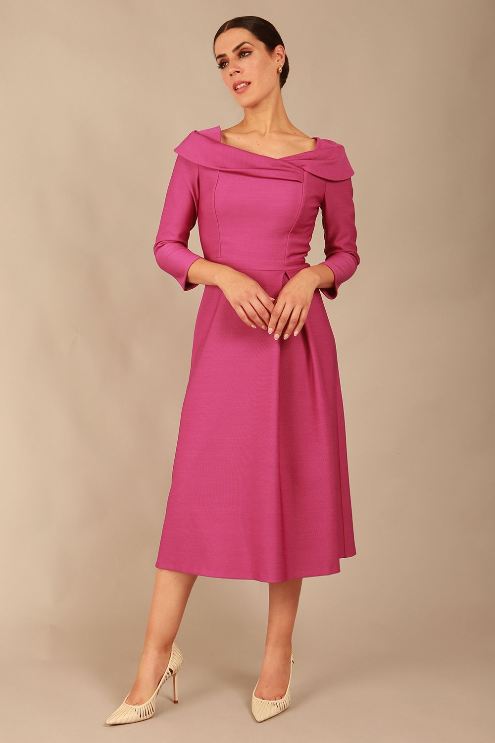 A model wearing a diva catwalk SEED Chrysanta sculptural collar dress in magenta mist 3/4 sleeve A-line dress with a round neckline and concealed zip at the back (Magenta Mist)