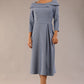 A model wearing a diva catwalk SEED Chrysanta sculptural collar dress 3/4 sleeve A-line dress with a round neckline and concealed zip at the back (Steel Blue)