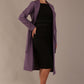 Side view of the Paloma tie-waist coat, highlighting its elegant midi length and fluid drape (Dusky Lilac)