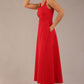 model wearing a diva catwalk Tamsin Square Neckline Swing Dress sleeveless style with a midaxi  length and side pockets in Scarlet Red colour