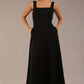 model wearing a diva catwalk Tamsin Square Neckline Swing Dress sleeveless style with a midaxi  length and side pockets in Black colour