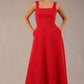 model wearing a diva catwalk Tamsin Square Neckline Swing Dress sleeveless style with a midaxi  length and side pockets in Scarlet Red colour