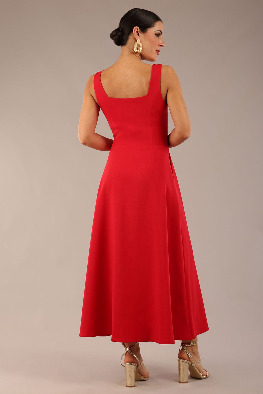 model wearing a diva catwalk Tamsin Square Neckline Swing Dress sleeveless style with a midaxi  length and side pockets in Scarlet Red colour back