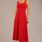 brunette model is wearing a diva catwalk Tamsin Square Neckline Swing Dress sleeveless style with a midaxi  length and side pockets in scarlet red colour front