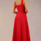 brunette model is wearing a diva catwalk Tamsin Square Neckline Swing Dress sleeveless style with a midaxi  length and side pockets in scarlet red colour back