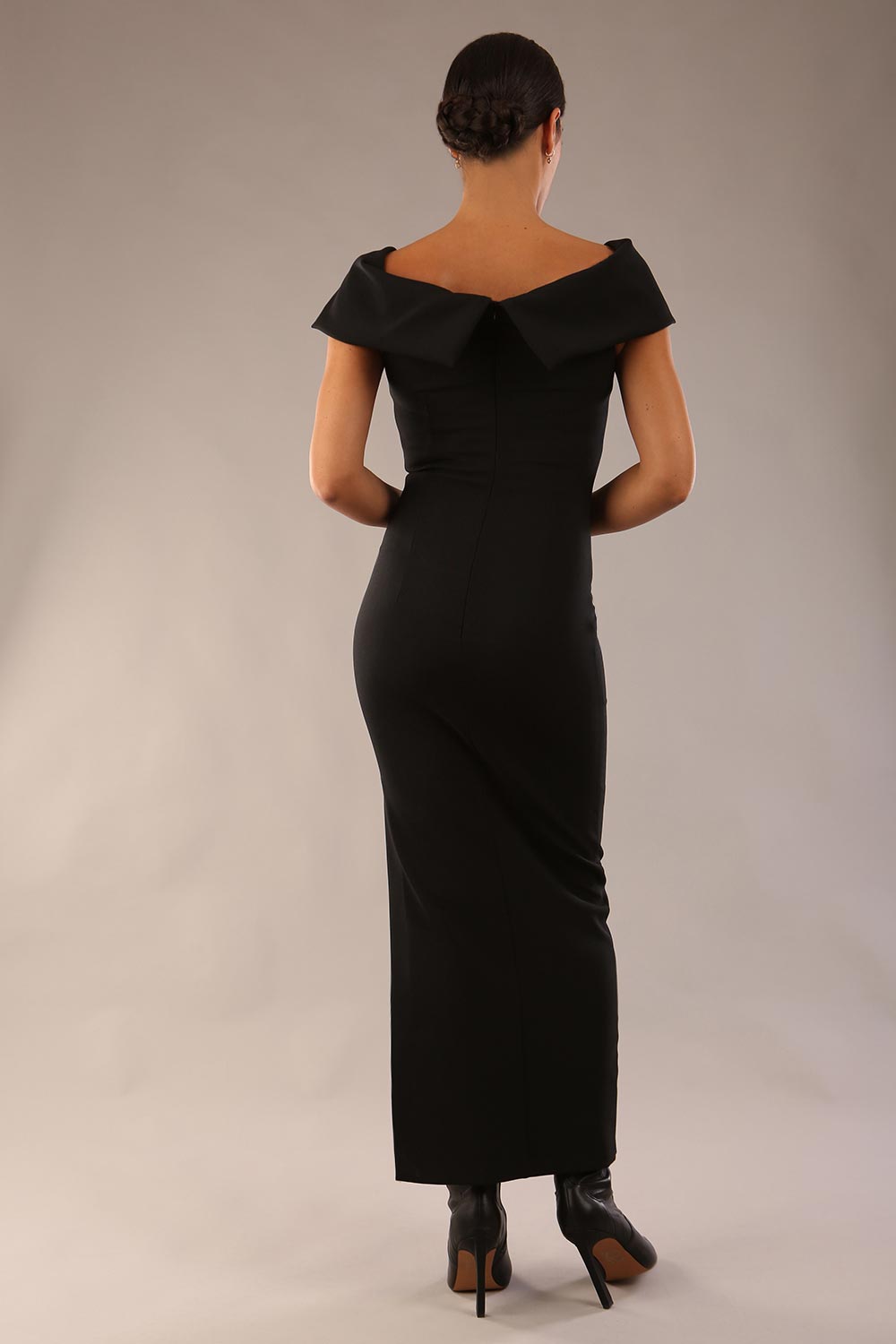 model is wearing a diva catwalk Mariposa Longer Length Dress off the shoulder bardot neckline and midaxi length in Black colour