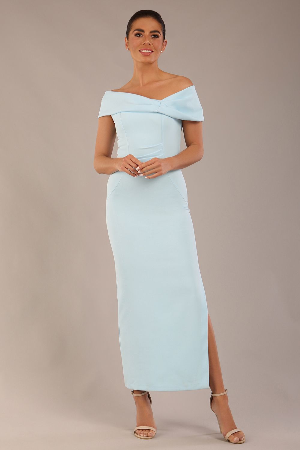 brunette model is wearing a diva catwalk Mariposa Longer Length Dress off the shoulder bardot neckline and midaxi length in sky blue colour front image