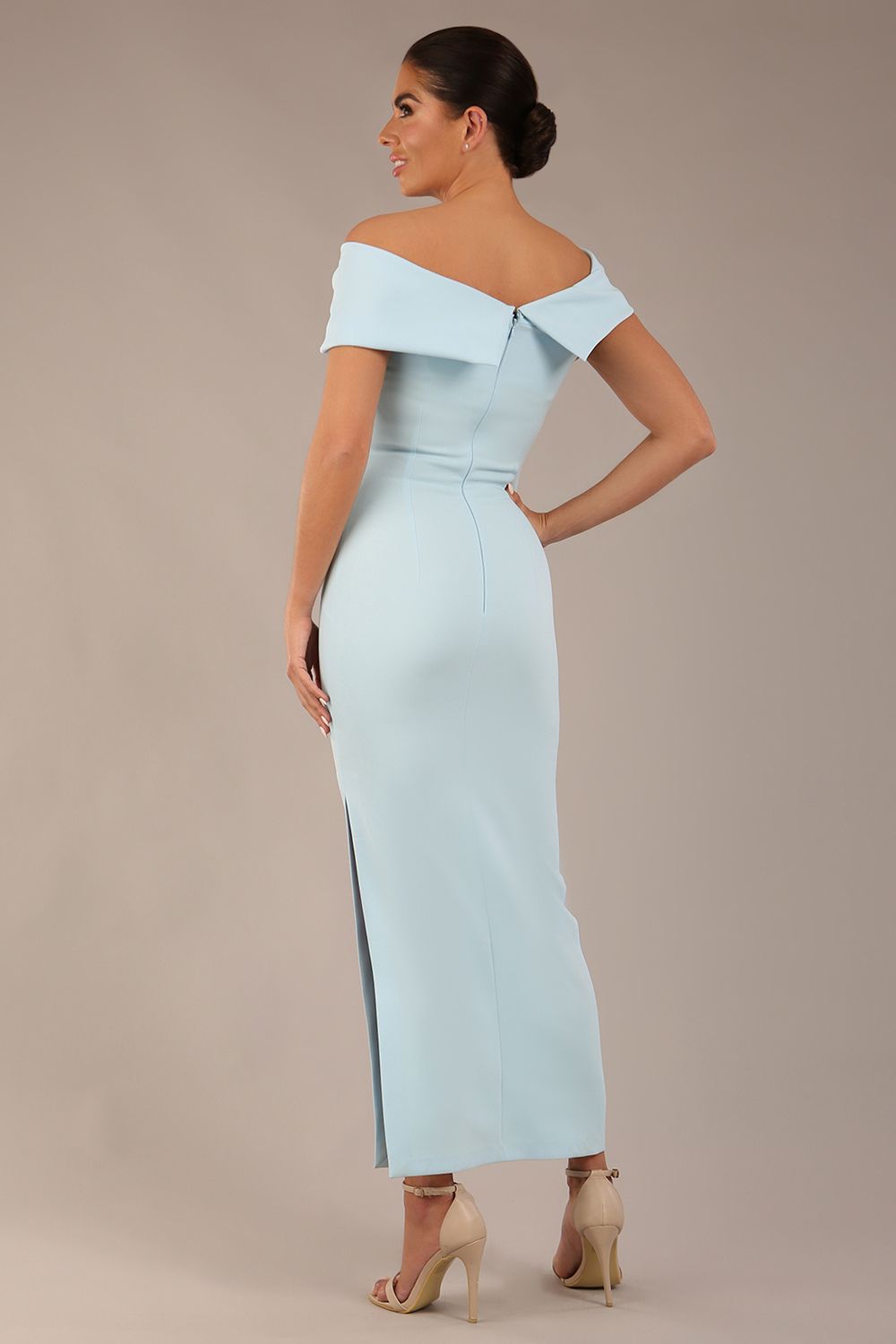 brunette model is wearing a diva catwalk Mariposa Longer Length Dress off the shoulder bardot neckline and midaxi length in sky blue colour back image