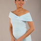 brunette model is wearing a diva catwalk Mariposa Longer Length Dress off the shoulder bardot neckline and midaxi length in sky blue colour front image close up