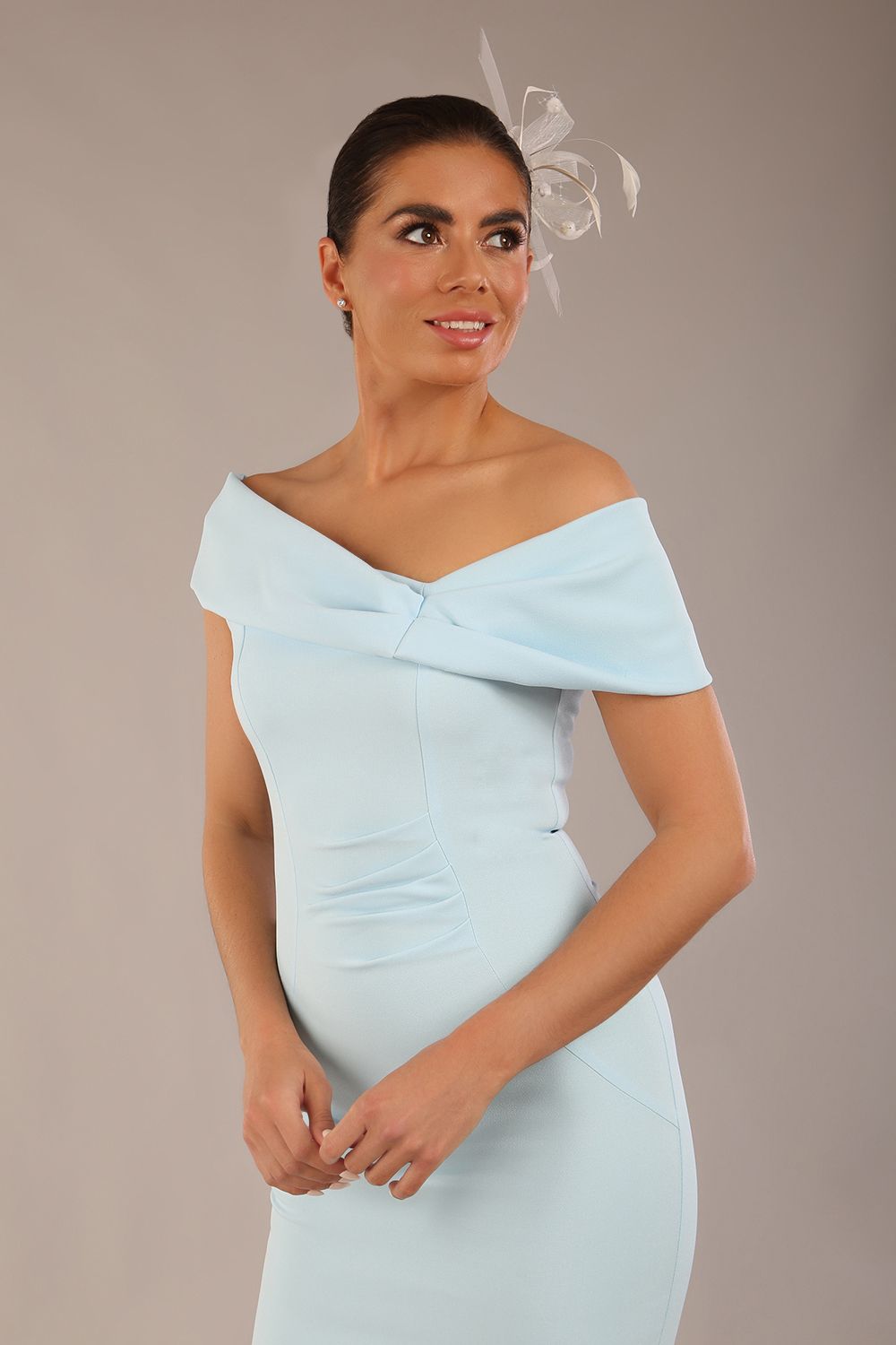 brunette model is wearing a diva catwalk Mariposa Longer Length Dress off the shoulder bardot neckline and midaxi length in sky blue colour front image close up