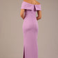 brunette model is wearing a diva catwalk Mariposa Longer Length Dress off the shoulder bardot neckline and midaxi length in sheer lilac colour back image