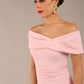 brunette model is wearing a diva catwalk Mariposa Longer Length Dress off the shoulder bardot neckline and midaxi length in crystal pink colour front image close up