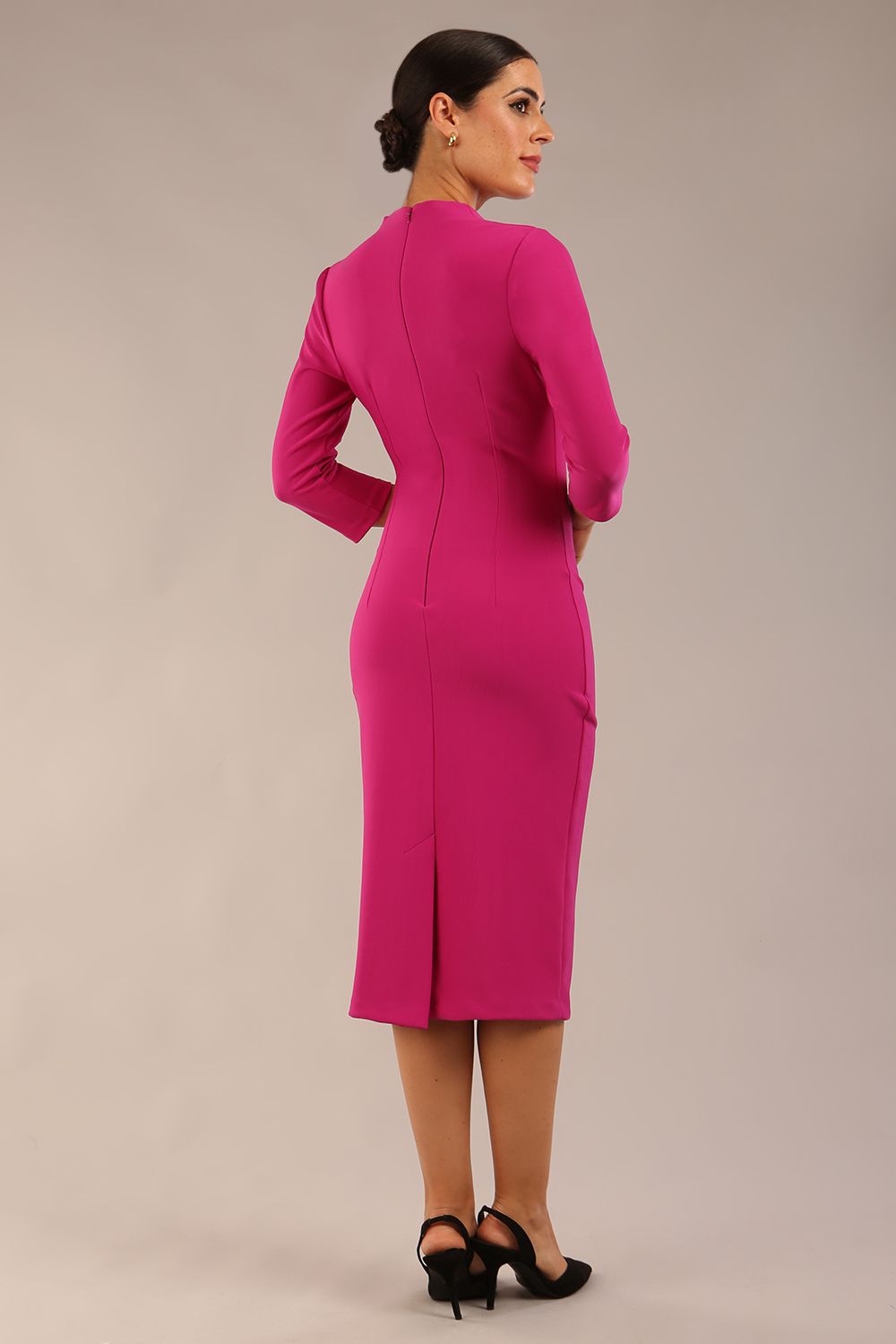 model wearing a diva catwalk Asymetric 3/4 Sleeves Pencil Dress with 3/4 sleeves knee length and asymmetric neckline in magenta haze colour back image