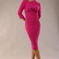 model wearing a diva catwalk Asymetric 3/4 Sleeves Pencil Dress with 3/4 sleeves knee length and asymmetric neckline in magenta haze colour front image