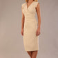 model wearing a diva catwalk Caprice Cap Sleeved Pencil Dress cap sleeve v neckline knee length with pleating details in sandshell beige colour front