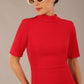 brunette model is wearing a diva catwalk Highmoor Short Sleeved Pencil Dress high neckline and shoulders pad in true red colour front image