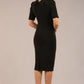 model is wearing a diva catwalk Highmoor Short Sleeved Pencil Dress high neckline and shoulders pads in black colour back
