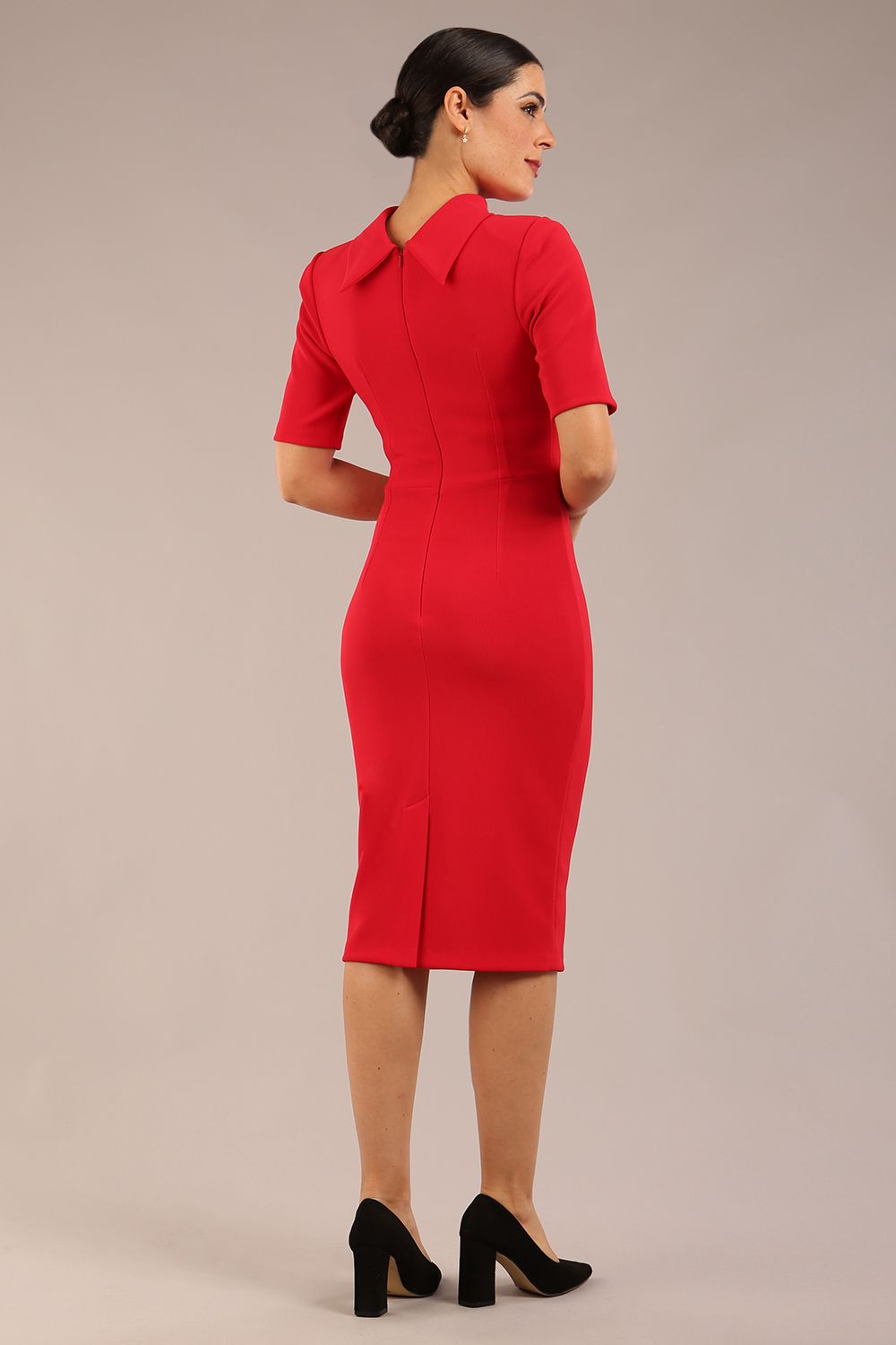 model is wearing a diva catwalk Highmoor Short Sleeved Pencil Dress high neckline and shoulders pad in true red colour back