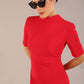 model is wearing a diva catwalk Highmoor Short Sleeved Pencil Dress high neckline and shoulders pad in true red colour