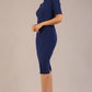 model is wearing a diva catwalk Highmoor Short Sleeved Pencil Dress high neckline and shoulders pad in navy blue colour