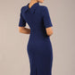 model is wearing a diva catwalk Highmoor Short Sleeved Pencil Dress high neckline and shoulders pad in navy blue colour back